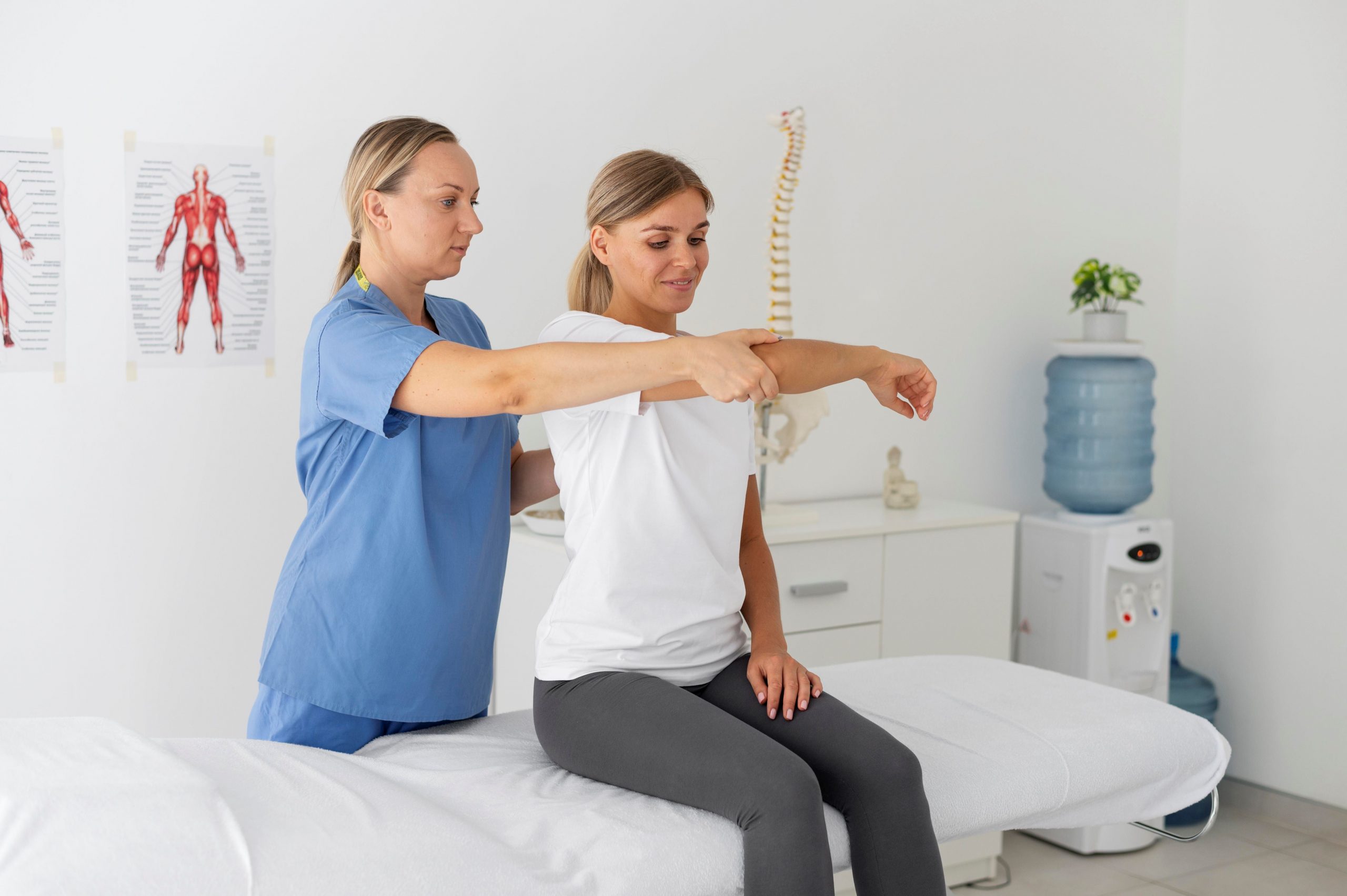Physical therapist helping a woman overcoming workout injury