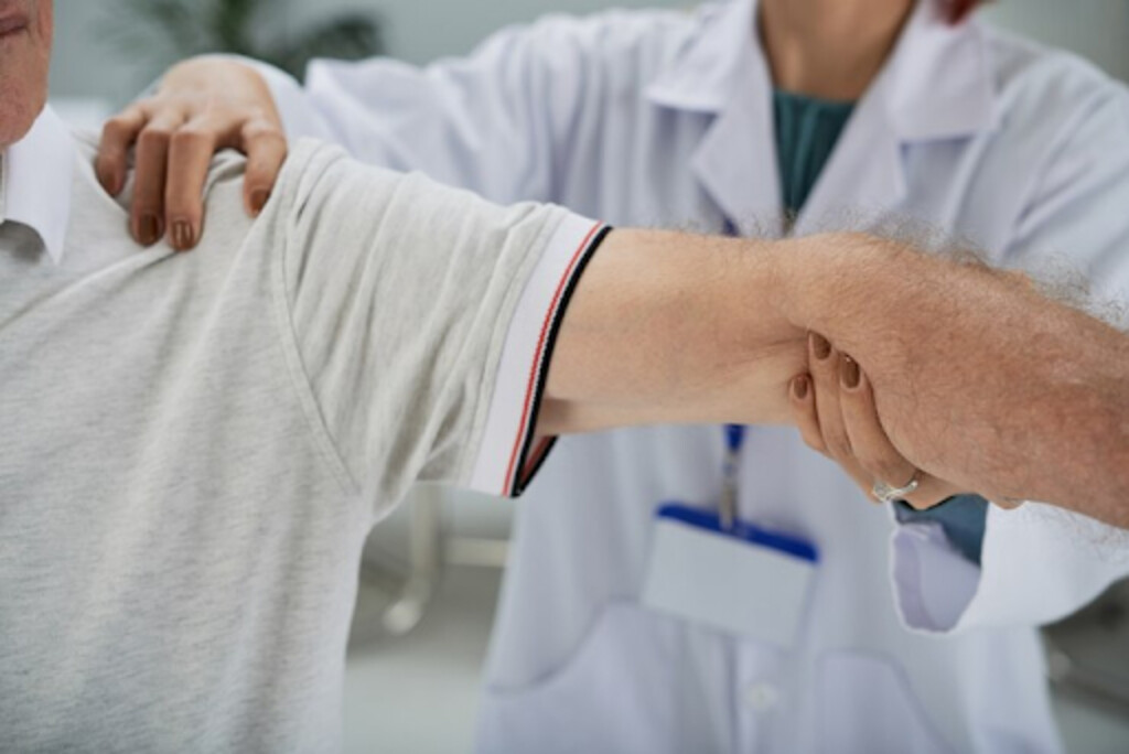 Hand doctor treating shoulder injury