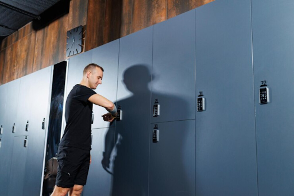 Men using gym locker