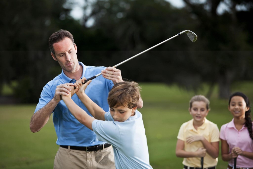 Kids Concentrating While Playing Golf