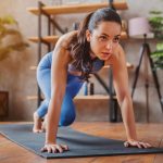Woman doing exercise to heal from breakup